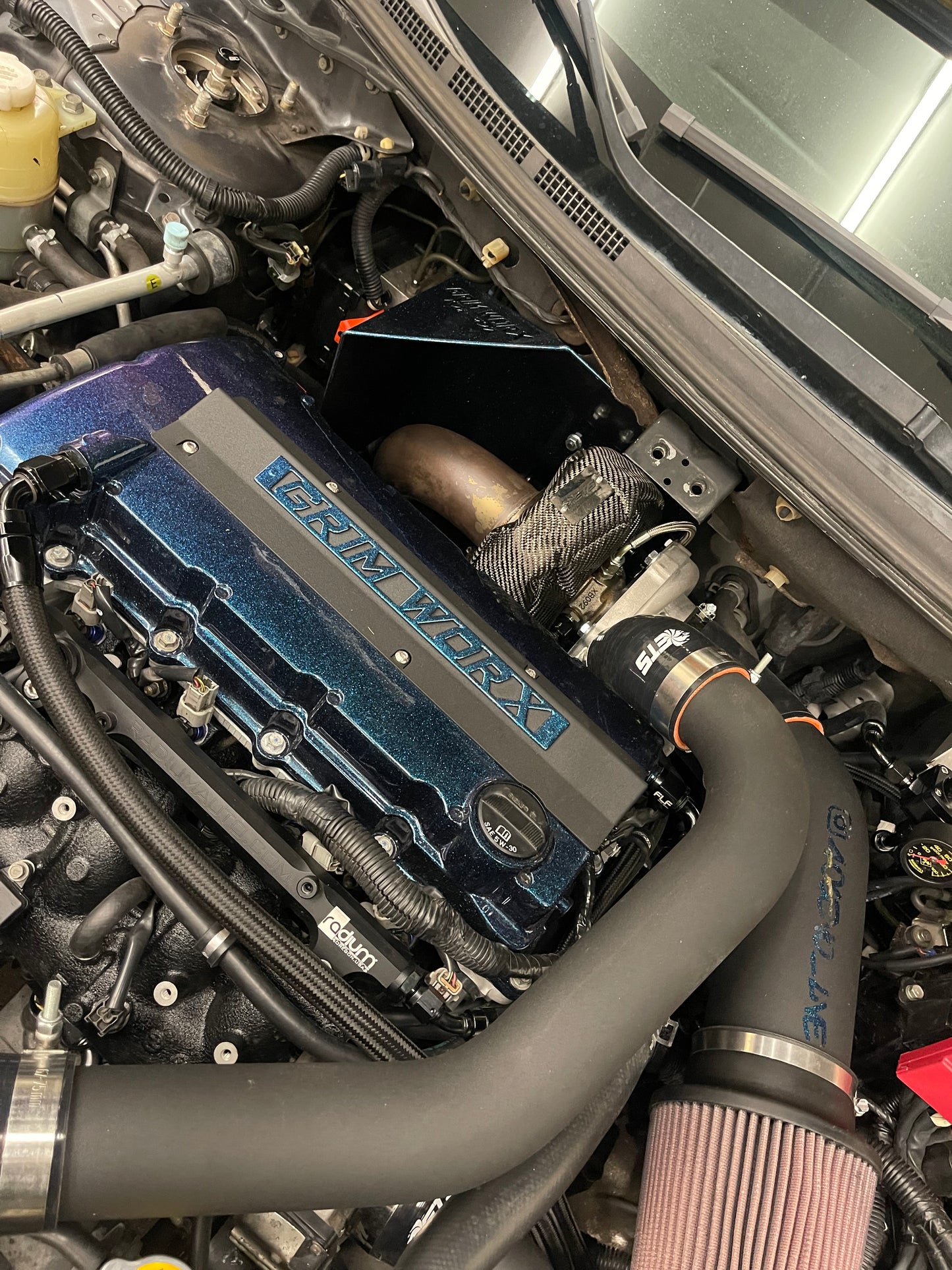 EVO X SPARK PLUG COVER PLATE